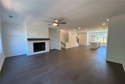 Enjoy the family room that leads to the dining and kitchen, where you never have to miss out on the fun! Cumming, GA New Home