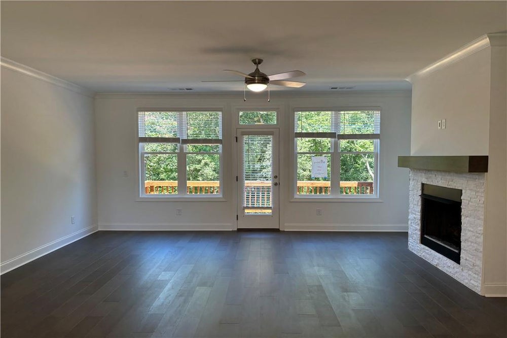 You will love the natural light that pours into this room!  Family room leads out to a large back deck. Perfect for entertaining. Cumming, GA New Home