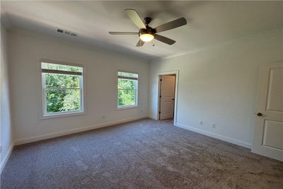 Primary has direct access to your new spacious walk-in closet. 145 Basil Street, 115, Cumming, GA