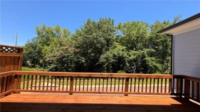 Back of the home looks directly to a private wooded lot! Cumming, GA New Home