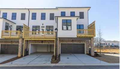 Driveways are in the back of the home.  Decks will face the woods for extra privacy. Picture not of actual home for representation purposes only. 3br New Home in Cumming, GA