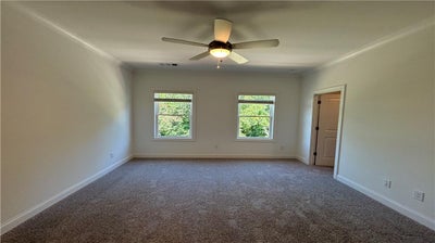 Primary bedroom has luxury bathroom, lots of closet space. 3br New Home in Cumming, GA