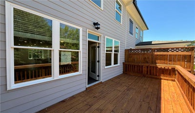 Back deck off of the family room provided privacy and entertaining room.  Or just soak up the sun and relax! 1,893sf New Home in Cumming, GA